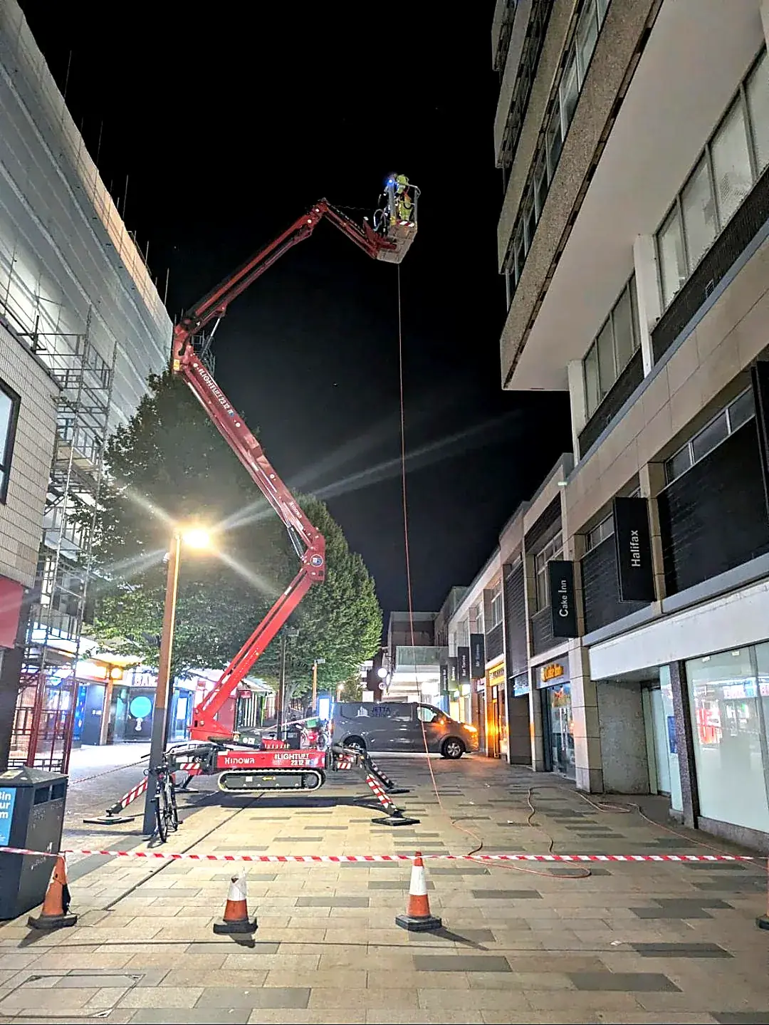 Powered access platform at night
